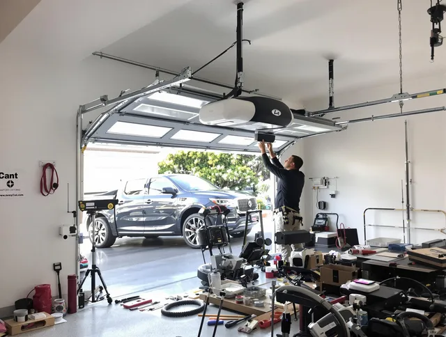 Greenwich Garage Door Repair specialist installing smart garage door opener system in Greenwich home
